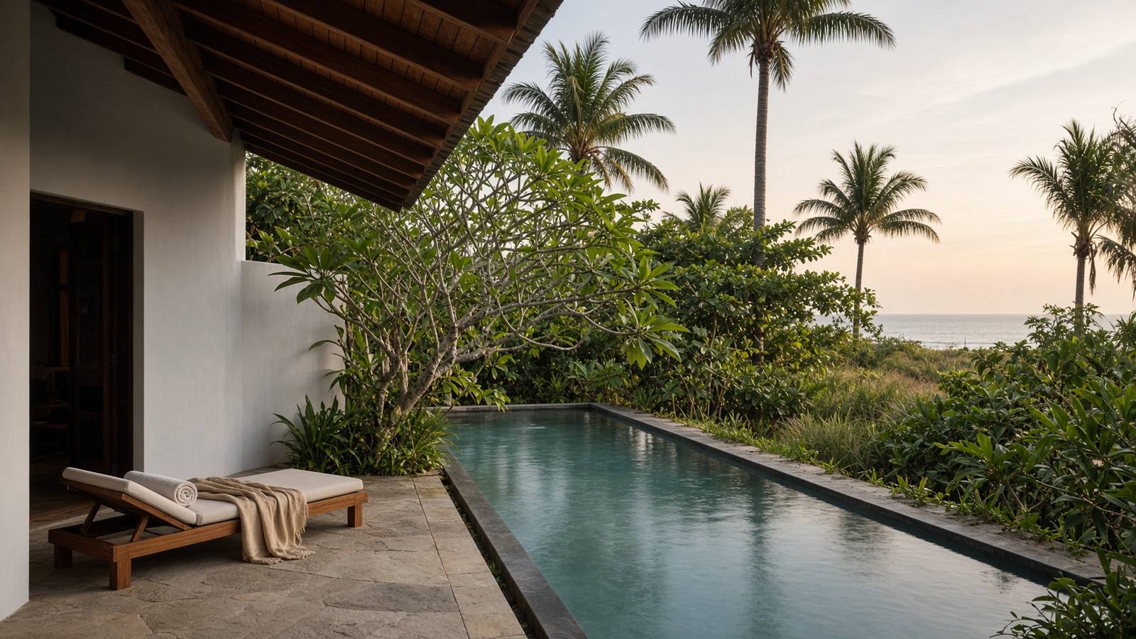 Illustrative photograph of a low coastal house, a still pool and palms. Not a property offered by Anna Comfy Homes.